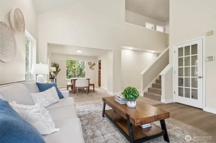 New carpet throughout the living and dining rooms add softness and warmth underfoot. It creates a clean, inviting atmosphere. The home’s traditional architecture blends beautifully with its natural surroundings. It offers timeless charm paired with modern updates.