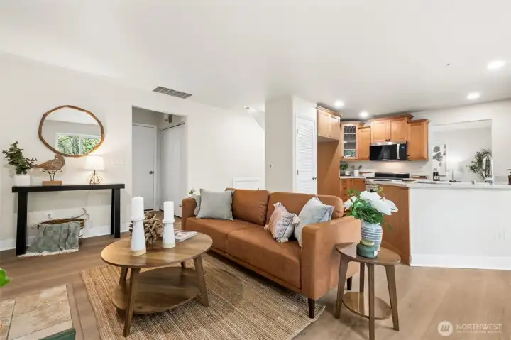 The family room offers a cozy gas fireplace and seamless connection to the kitchen. It’s a warm, comfortable space designed for everyday living. Fresh LVP flooring adds durability and style to the main living areas. The updated finishes make the home feel modern and move-in ready.