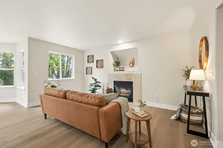 The family room offers a cozy gas fireplace and seamless connection to the kitchen. It’s a warm, comfortable space designed for everyday living. Fresh LVP flooring adds durability and style. The updated finishes make the home feel modern and move-in ready.