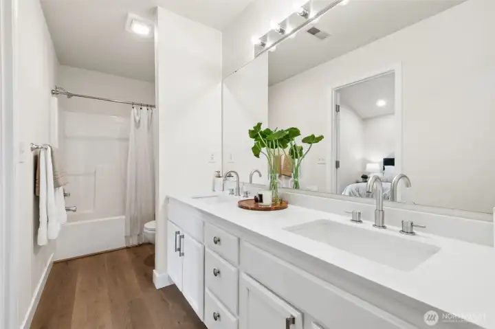 The primary bathroom has been refreshed with modern updates, offering a clean and spacious space to start and end your day. A roomy walk-in closet adds convenience.