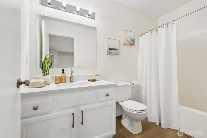 The updated full guest bathroom upstairs features modern finishes and a clean, refreshed look. It’s ready for daily routines or visiting guests.