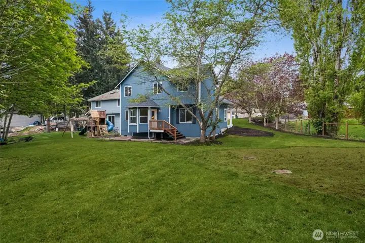 The expansive backyard offers room to roam. Backing to your own forest, it’s a peaceful sanctuary for outdoor living. With 1.73 acres of land, this property provides space for gardening, play, or future outdoor projects.