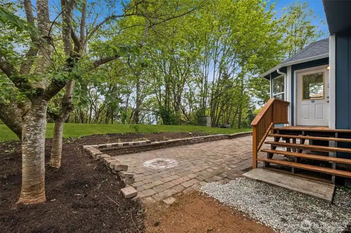 The forested backdrop creates a serene, natural setting that feels worlds away from the everyday. Enjoy the sights and sounds of nature right from your backyard.