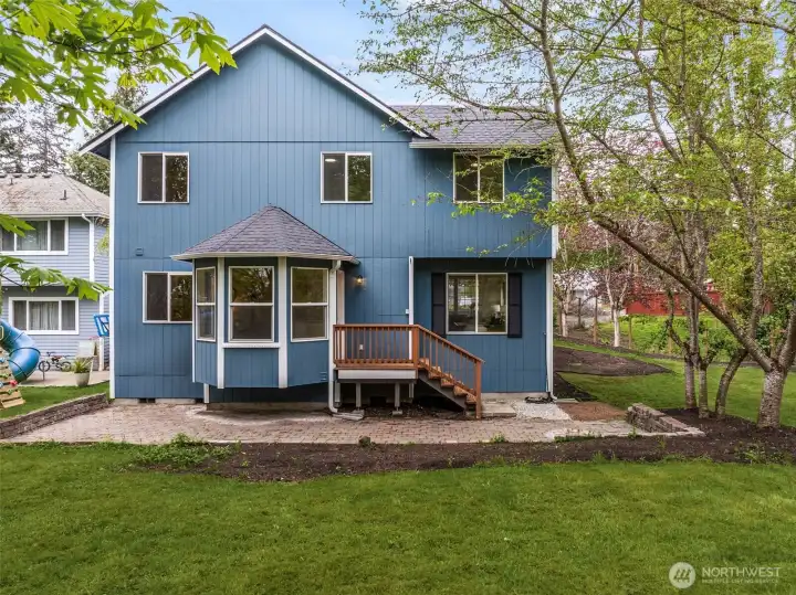Fresh exterior paint and a brand new roof enhances the home’s curb appeal and gives it a crisp, updated look. The surrounding greenery adds to the peaceful atmosphere.