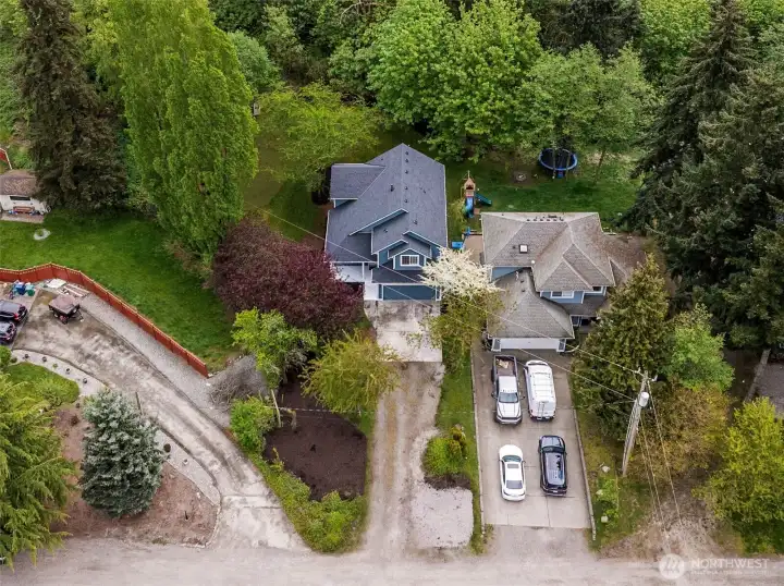 The long driveway offers a private, welcoming approach to the home. It sets the stage for the quiet, secluded lifestyle this property provides.