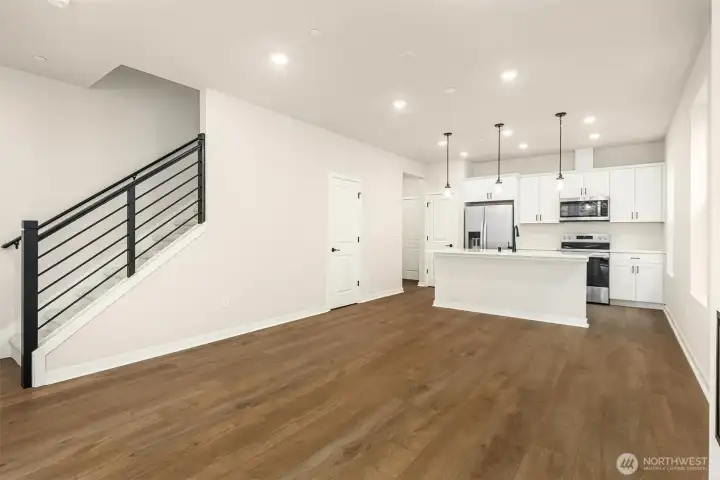 Horizontal metal stair railing. Similar home shown.