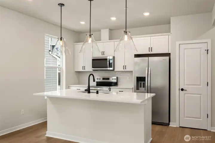 Home comes well equipped with side-by-side frig featuring water and ice dispenser in door