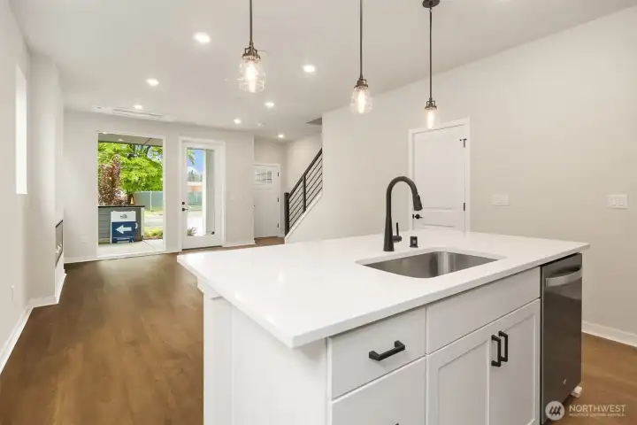 Cafe and gathering room from kitchen. Similar home shown.