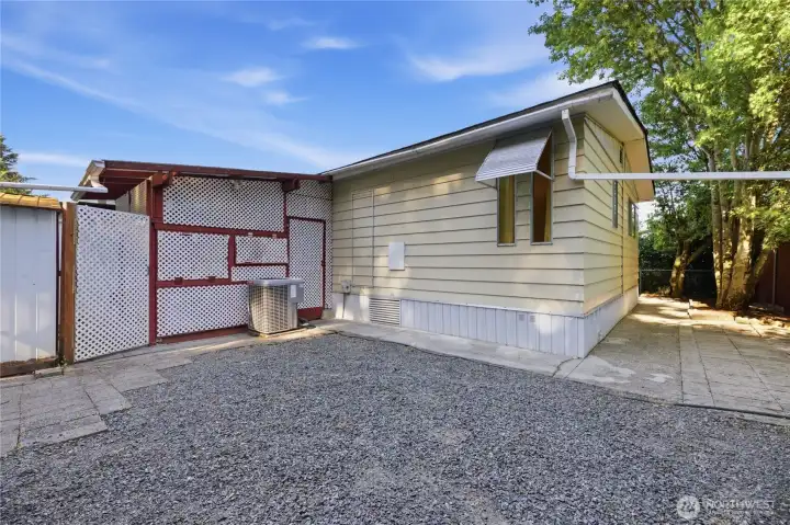 Outside of the enclosed patio.  Heat pump for the home