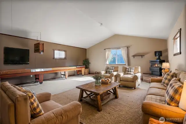 living area in apartment, shuffle board table included in sale!