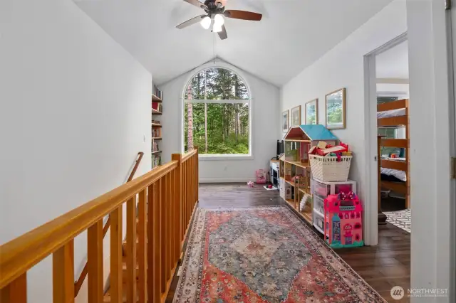 Upstairs reading nook with built-in shelving