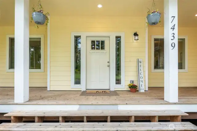 Step onto wraparound covered porch.