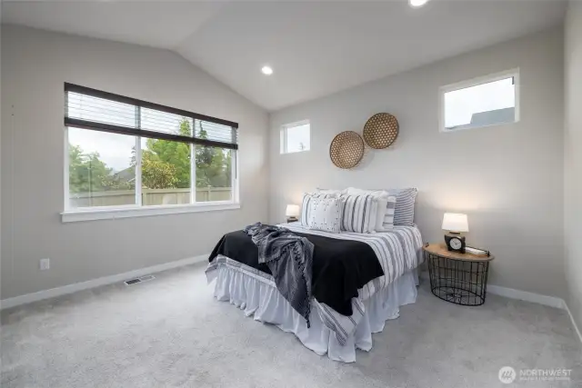 Main Floor Primary Suite with gorgeous easterly views of the Cultus Mountains
