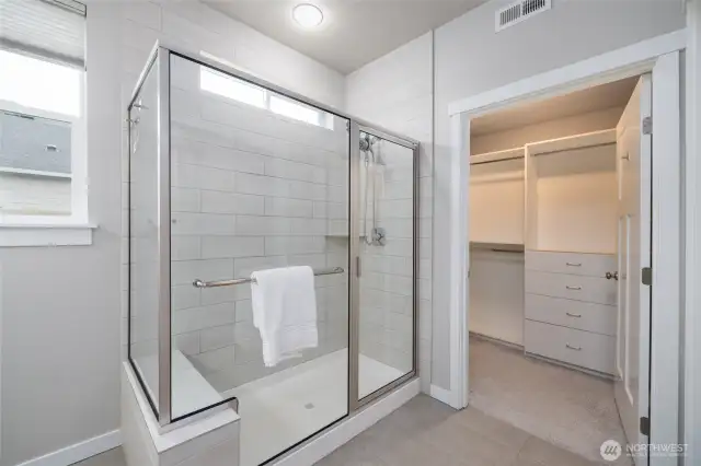 Primary ensuite bath with oversized walk-in tiled shower
