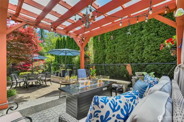 The lower patio is made of pavers and extends your entertaining space. Re-designed and landscaped a couple of years ago, this is an outdoor oasis. On the side of the house is a flagstone path and raised garden bed.