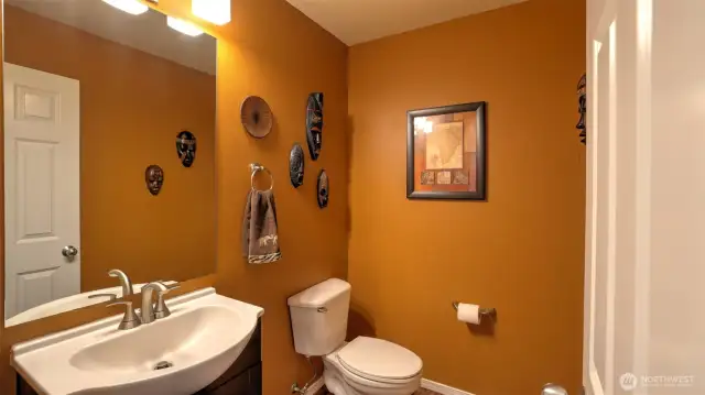 Convenient half bathroom located downstairs — perfect for guests or quick everyday use