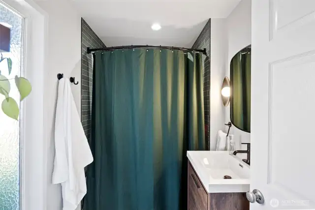 Fully remodeled bathroom in 2024 with ceramic tile flooring!