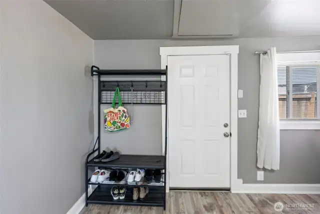 Enter from the side door with storage space & laundry facility