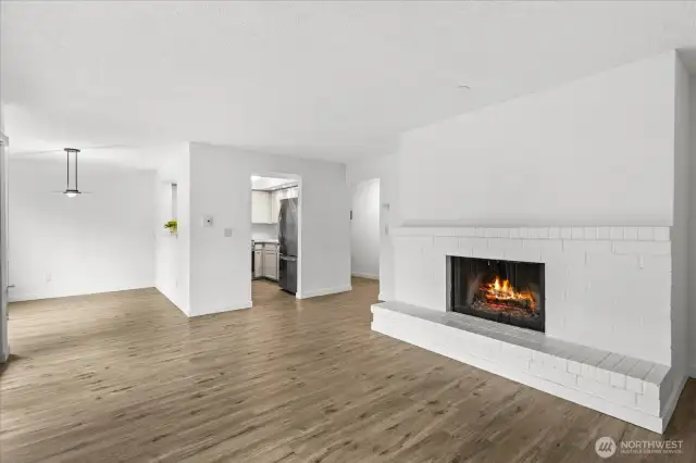 Spacious living area with a wood burning fireplace for those cozy winters.