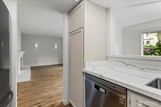 Large pantry cabinet for plenty of storage and  a convienient pass through to dining area.