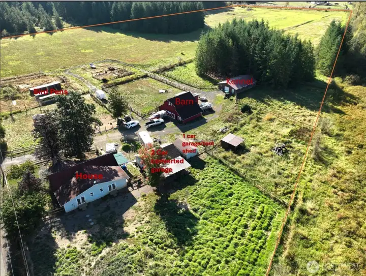 20 acres with fenced pastures, wooded areas, streams, ideal for hobby farm or continue to use as a dog kennel operation.