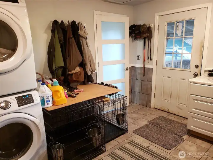 Huge laundry with two sets of washers/dryers included in sale.