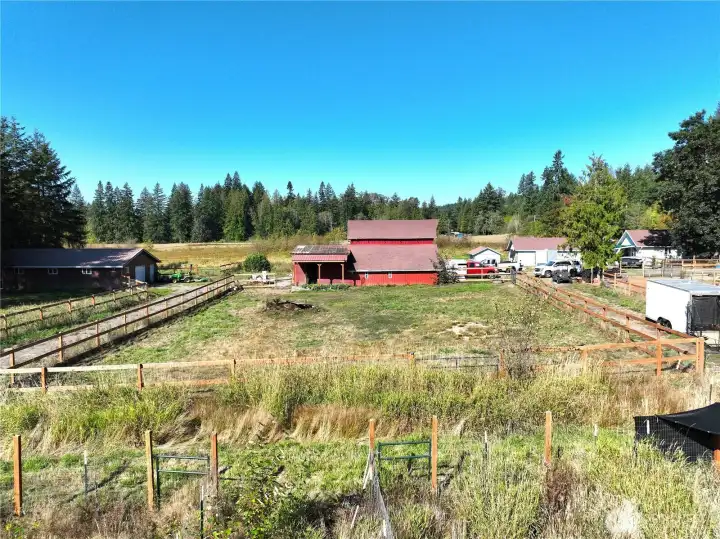 Multiple pastures with 3 rail fencing.