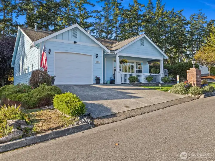This home offers a large covered front porch, complete with dog-gate for enjoying those morning cups of coffee