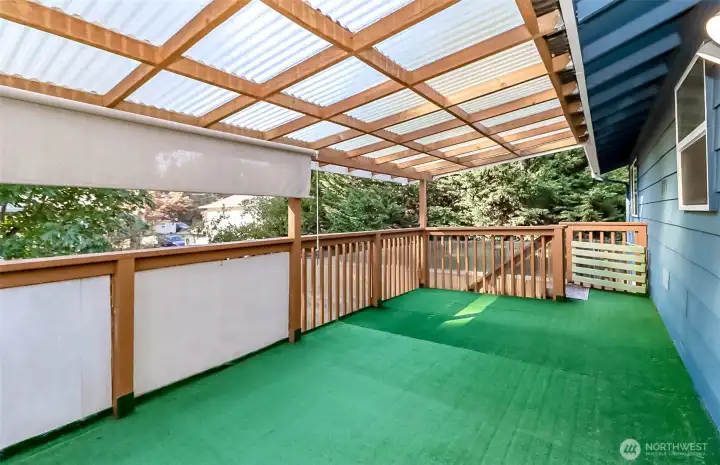 Spacious entertaining deck built with durable treated wood.