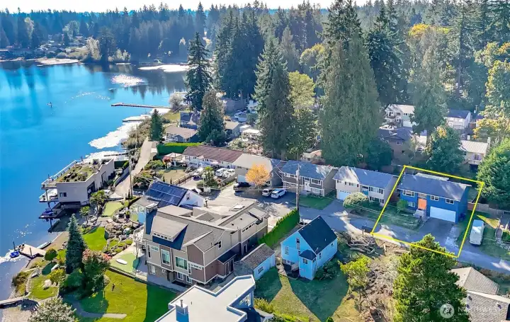 The home is located approximately 100 yards from the community-owned lakefront lot.