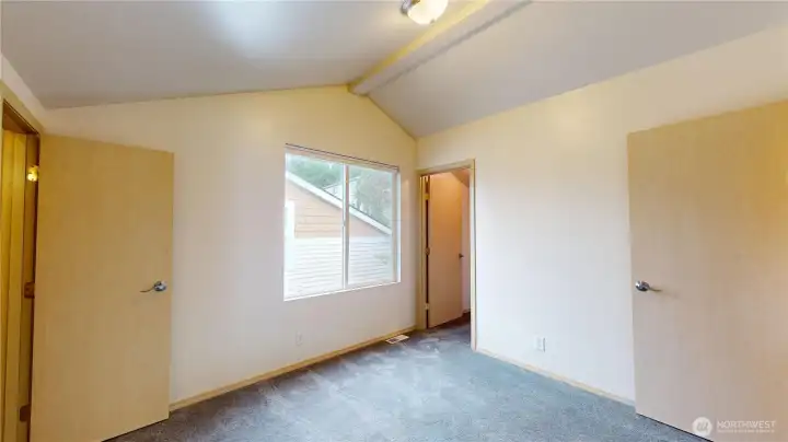 The second suite/bedroom has wonderful volume due to the vaulted ceilings. it also has access from the bedroom into the second floor bathroom!