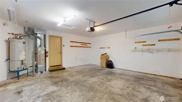 A look at the utilities in the garage.  These are very efficient gas fired furnace and hot water heater.  There is also an automatic garage door opener with key pad.