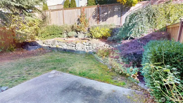 The yard is fully landscaped, terraced and fenced.