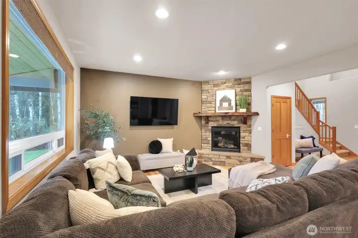 Bright + open living room with large windows and natural light.