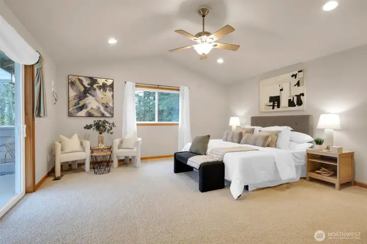 Beautiful primary bedroom with natural light.