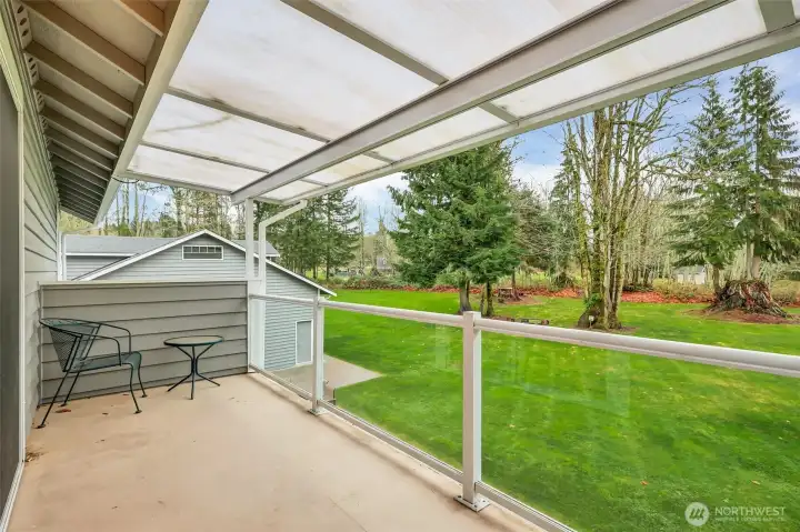 Private covered porch off the primary bedroom- perfect for QUIET moments overlooking the backyard.
