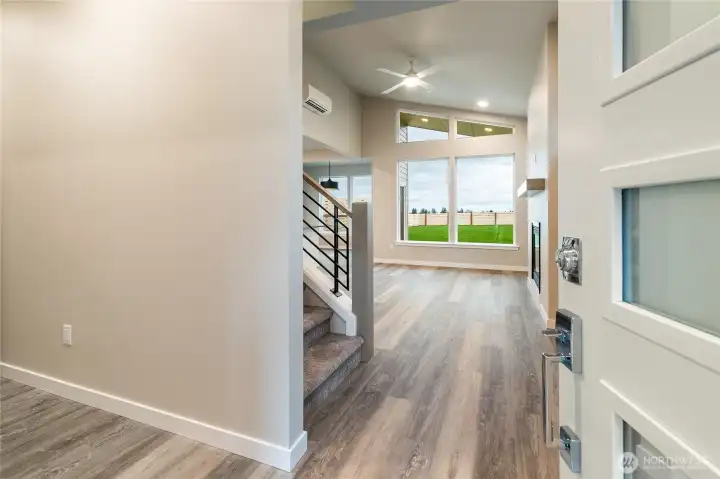 Main level entry opens to bedroom #3, laundry,3rd bath, living/kitchen