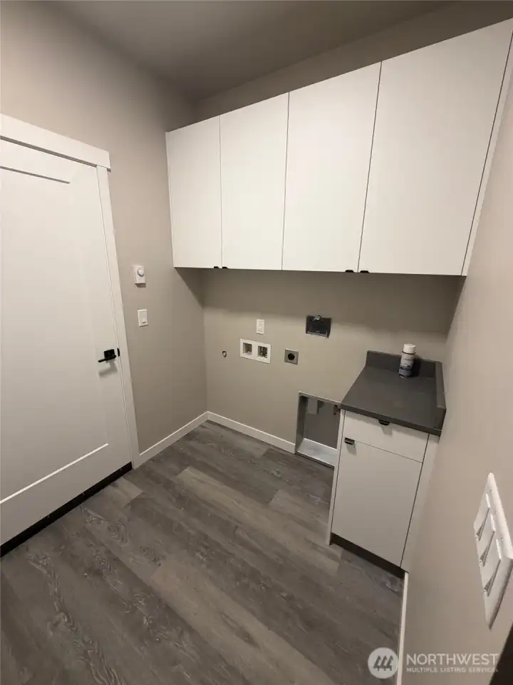 Laundry room with counter & cabinets
