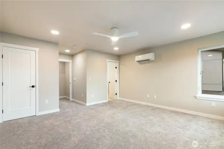 Primary suite with doors on right & left to ensuite & walk-in closet