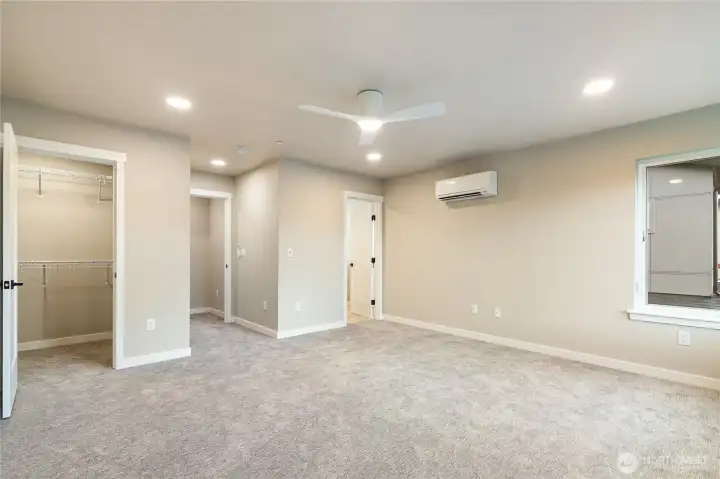 Primary walk-in closet to left