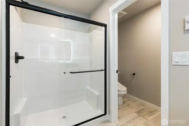 Ensuite with large walk-in shower + private lav area to right