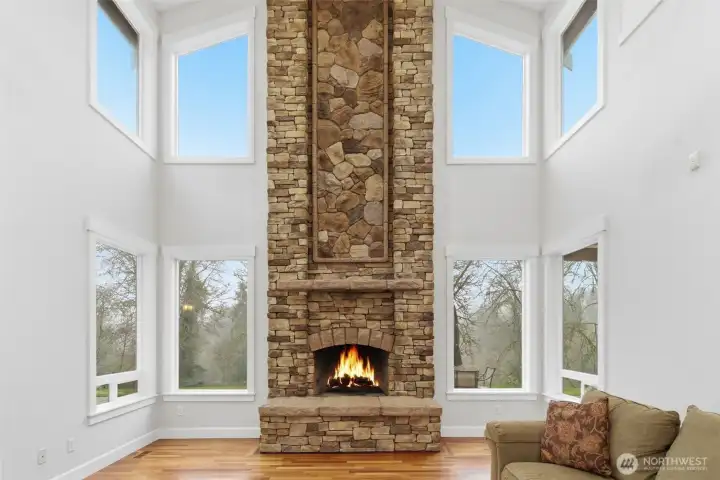 Custom floor to ceiling stone build fireplace, wood burning.
