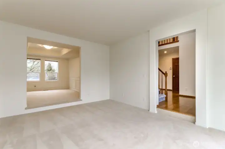 Living room is off the entry way and opens to the formal dining room