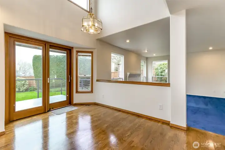 Informal dining area located between the kitchen and family room features two story ceiling and opens to the newer deck outside.