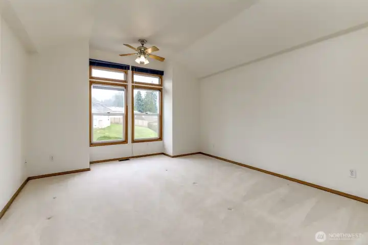 Upstairs primary bedroom with vaulted ceilings and dedicated mini split for comfort.