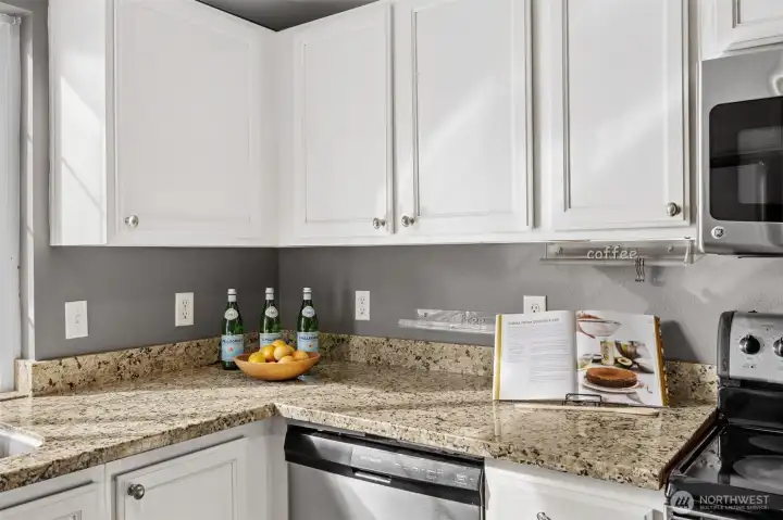 Granite counters compliment the abundance of cabinetry