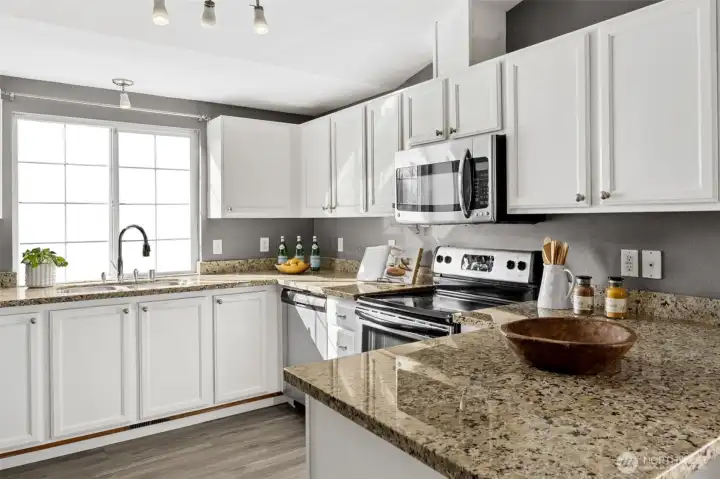 Stainless steel appliances along with abundant counter space is functional and elegant