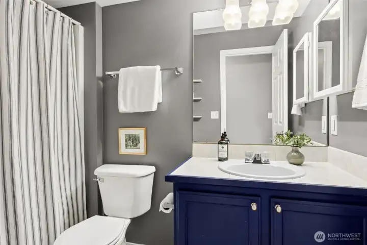 Full bathroom downstairs expands living options for multi-generational or shared housing situation