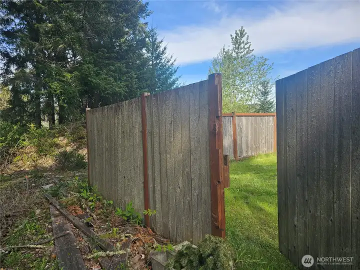 Backyard gate opens to the back of lot