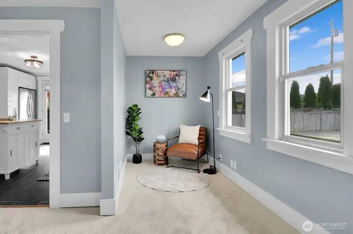 Great natural light in this cozy reading nook/craft area/play room.